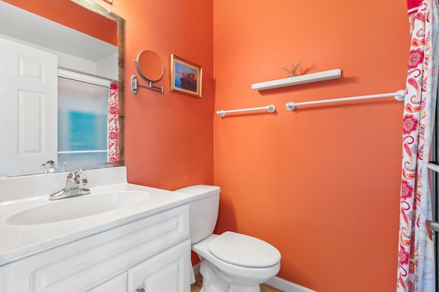 bathroom with toilet and vanity