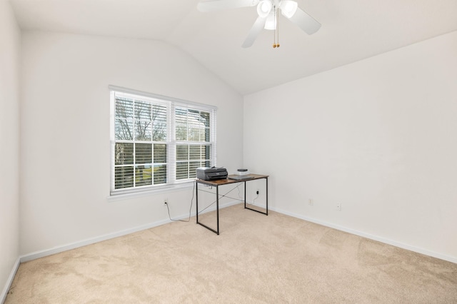 unfurnished office featuring lofted ceiling, carpet, baseboards, and ceiling fan