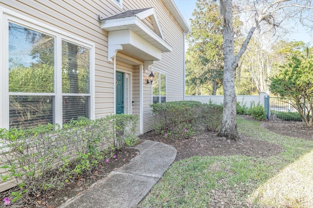 doorway to property with fence