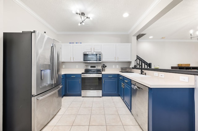 kitchen featuring light tile patterned floors, appliances with stainless steel finishes, ornamental molding, blue cabinets, and a peninsula