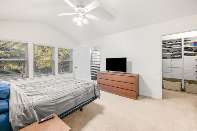 carpeted bedroom featuring lofted ceiling, ceiling fan, and baseboards