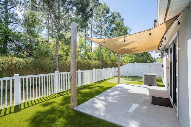view of patio with cooling unit and a fenced backyard