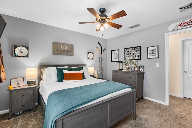 bedroom with baseboards, carpet flooring, and visible vents