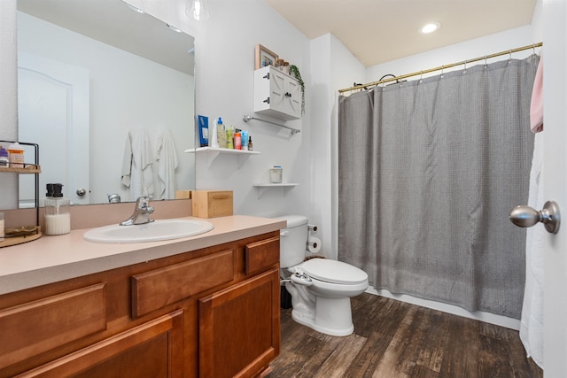 full bathroom with vanity, toilet, recessed lighting, and wood finished floors