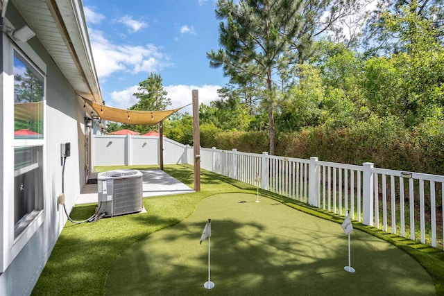 view of yard with cooling unit, a patio area, and a fenced backyard
