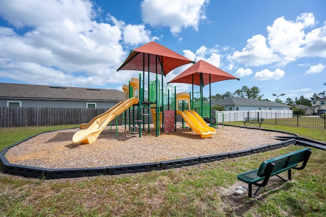 community jungle gym featuring fence