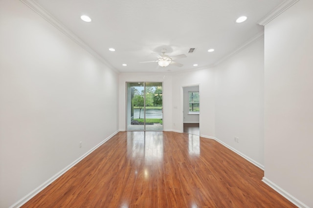 empty room featuring crown molding, wood finished floors, a ceiling fan, and recessed lighting