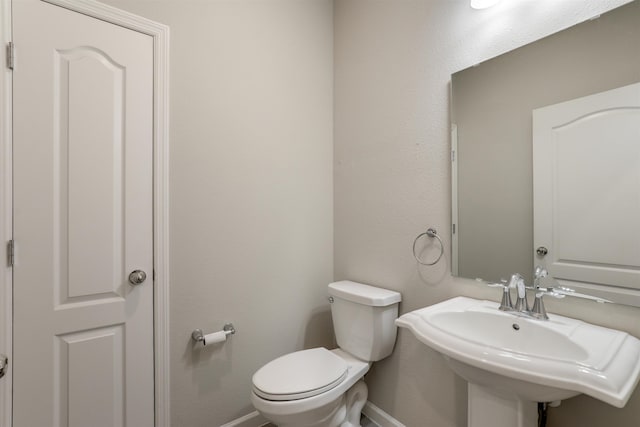 bathroom with toilet and sink