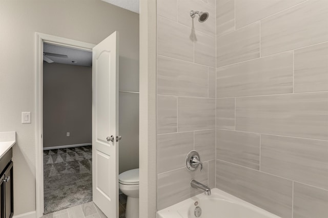 full bathroom featuring vanity, toilet, and tiled shower / bath combo