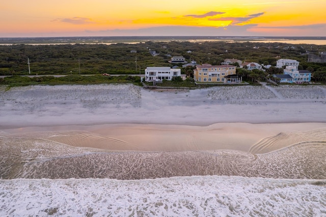 aerial view at dusk with a water view