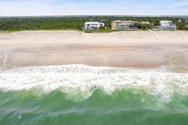 aerial view with a water view and a beach view