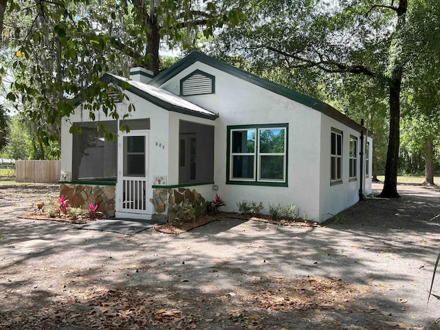 221 Old Peniel Rd, Palatka, FL 32177 - bungalow-style house with fence and stucco siding