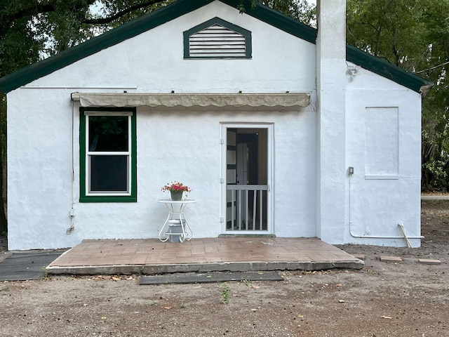 221 Old Peniel Rd, Palatka, FL 32177 - back of house featuring stucco siding