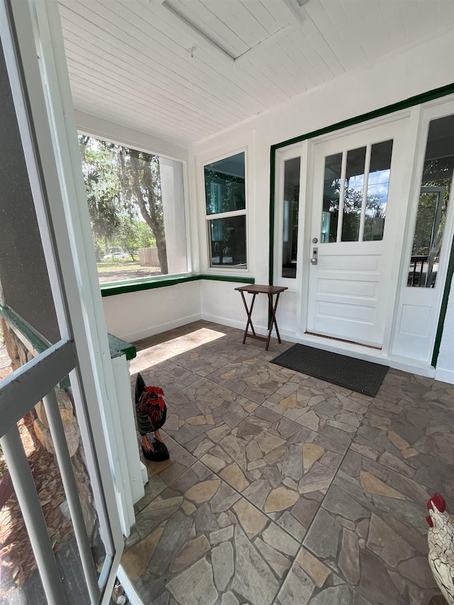 221 Old Peniel Rd, Palatka, FL 32177 - unfurnished sunroom featuring stone floors and wooden ceiling