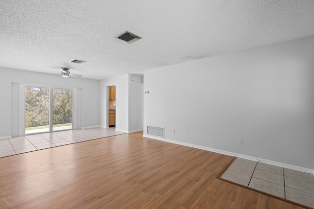 422 Nervia Ct, Saint Augustine, FL 32086 - empty room featuring a textured ceiling, visible vents, and light wood-style floors