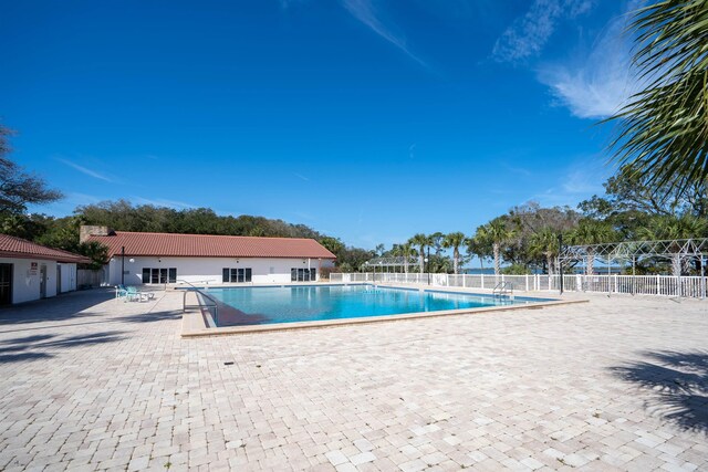 422 Nervia Ct, Saint Augustine, FL 32086 - pool featuring a patio area and fence