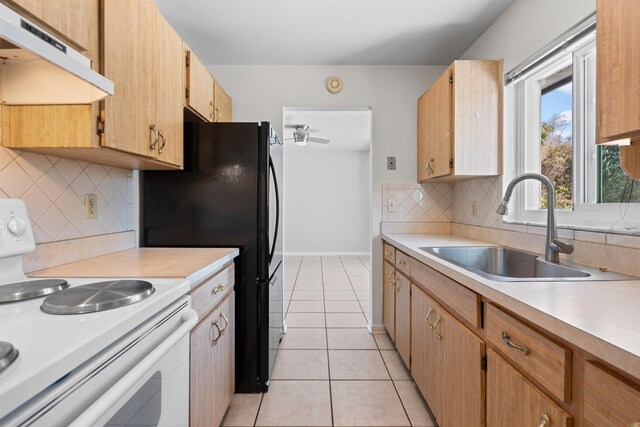 422 Nervia Ct, Saint Augustine, FL 32086 - kitchen featuring light tile patterned floors, light countertops, white electric range, a sink, and under cabinet range hood
