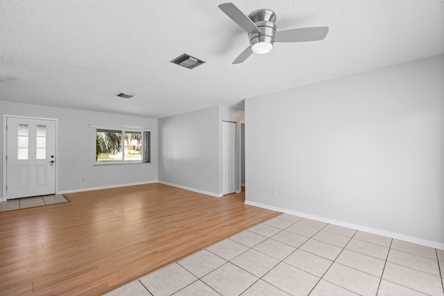 422 Nervia Ct, Saint Augustine, FL 32086 - spare room featuring baseboards, light wood-style flooring, visible vents, and a textured ceiling
