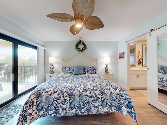 301 Premier Vista Way, Saint Augustine, FL 32080 - bedroom with light wood-style flooring, access to outside, a ceiling fan, a barn door, and ensuite bath