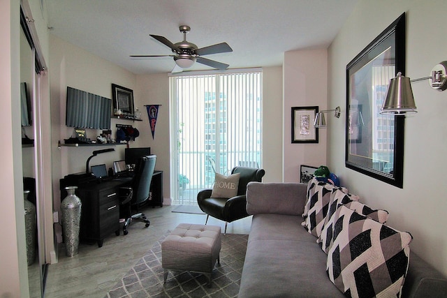 office space with ceiling fan and light hardwood / wood-style floors