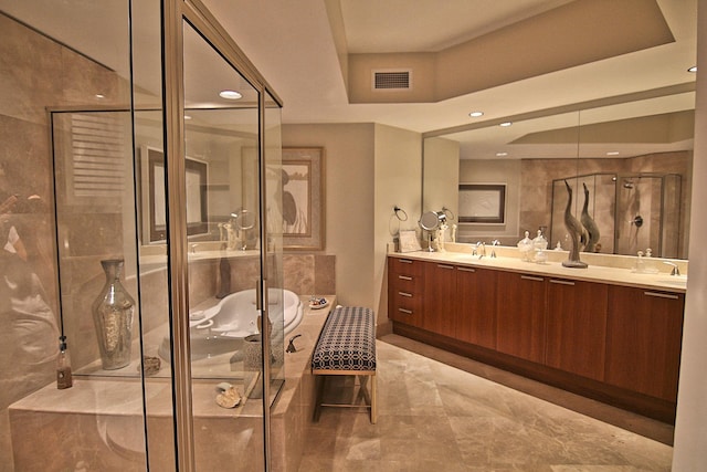 bathroom with an enclosed shower and vanity