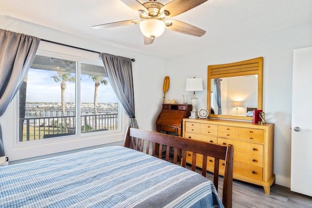 bedroom featuring light hardwood / wood-style flooring and ceiling fan