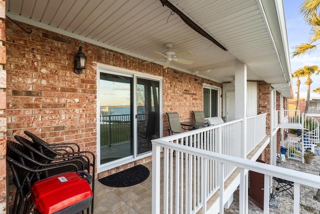 exterior space featuring ceiling fan