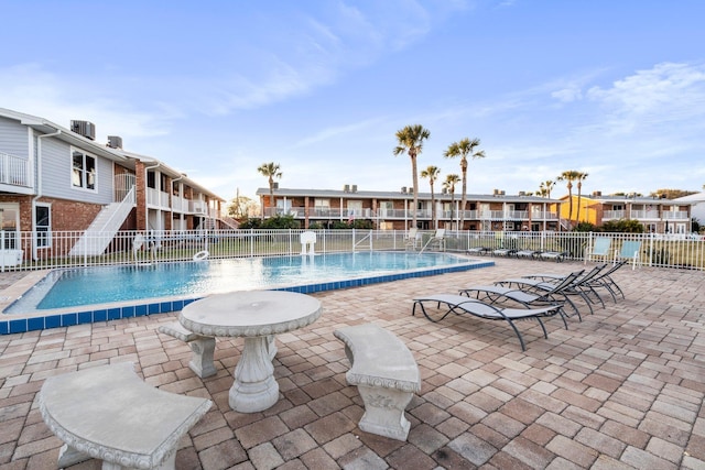 view of swimming pool with a patio area