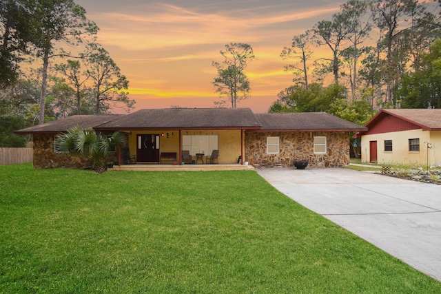 ranch-style house featuring a yard