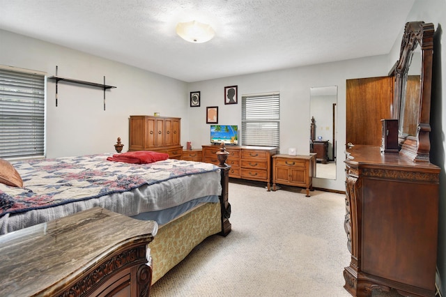 carpeted bedroom with a textured ceiling