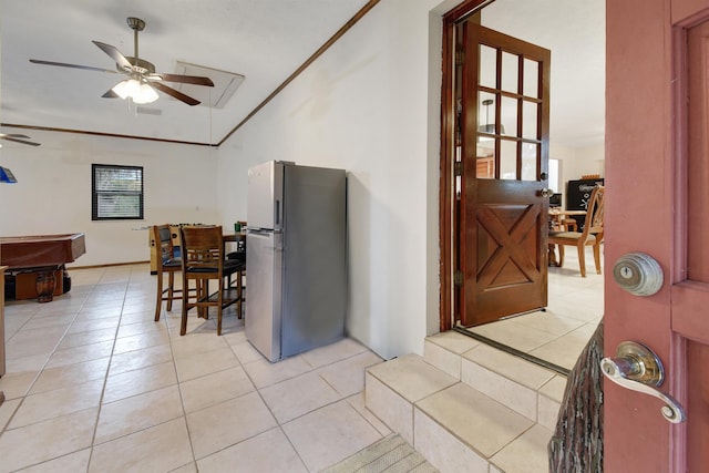 kitchen with stainless steel fridge, ceiling fan, crown molding, light tile patterned floors, and billiards