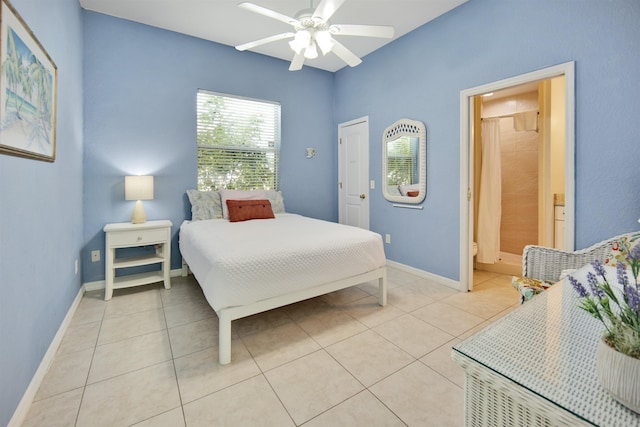 tiled bedroom featuring ceiling fan and ensuite bathroom