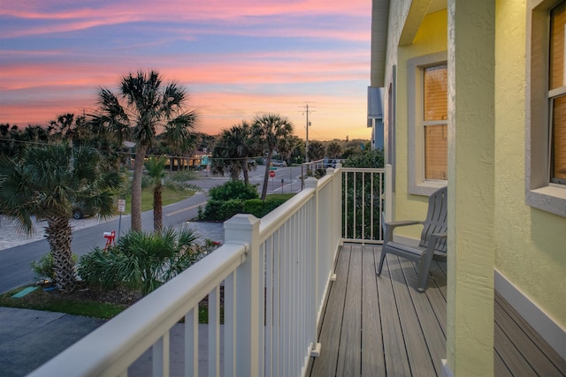 view of balcony at dusk