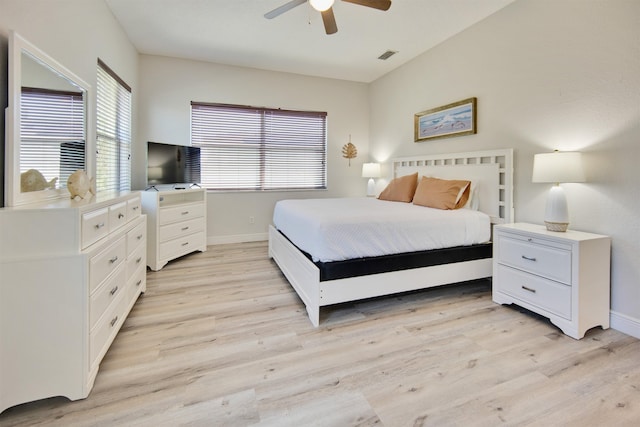 bedroom with ceiling fan and light hardwood / wood-style floors