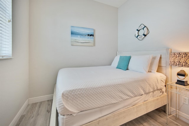 bedroom with light wood-type flooring