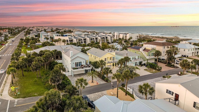 aerial view at dusk with a water view