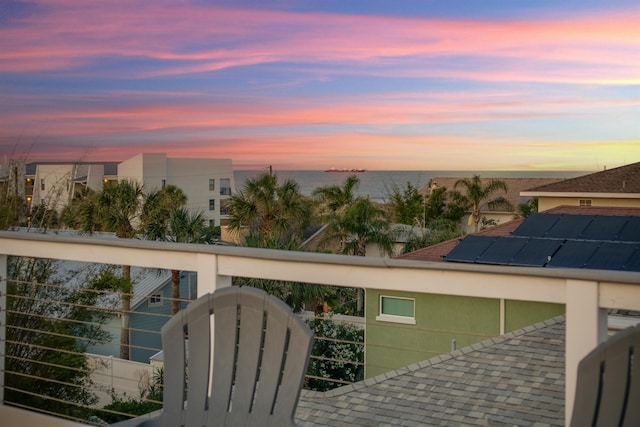 balcony at dusk with a water view