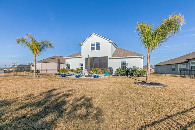 back of property featuring a yard