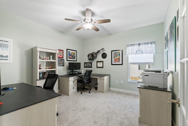 carpeted office with ceiling fan