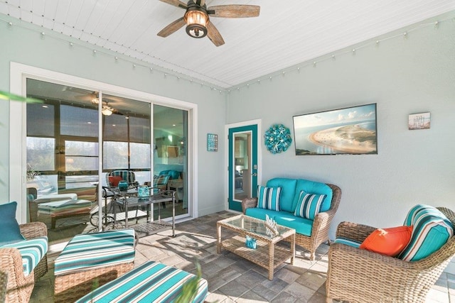 interior space featuring rail lighting and ceiling fan