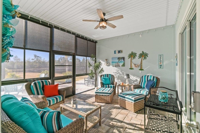 sunroom / solarium with ceiling fan