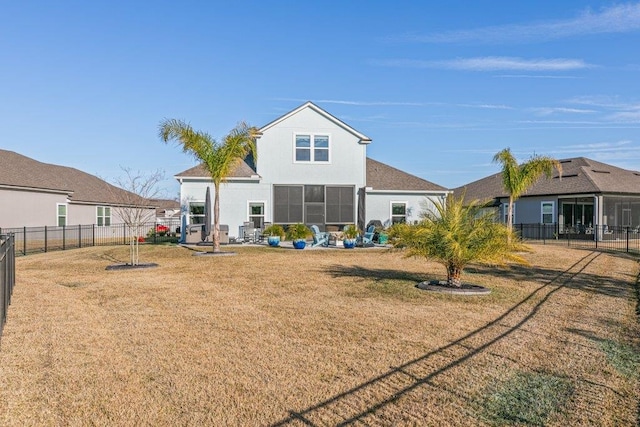 back of house with a lawn