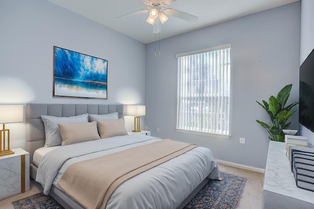 carpeted bedroom with ceiling fan