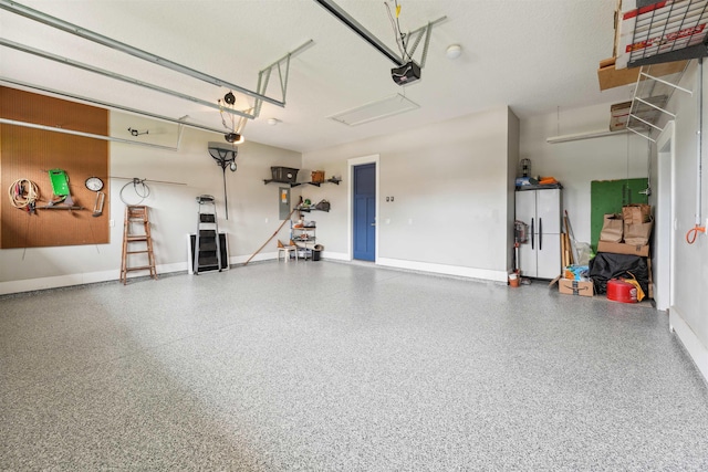 213 Pescado Dr, Saint Augustine, FL 32095 - garage with a garage door opener and baseboards