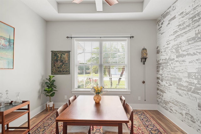 213 Pescado Dr, Saint Augustine, FL 32095 - dining area featuring an accent wall, healthy amount of natural light, a ceiling fan, wood finished floors, and wallpapered walls