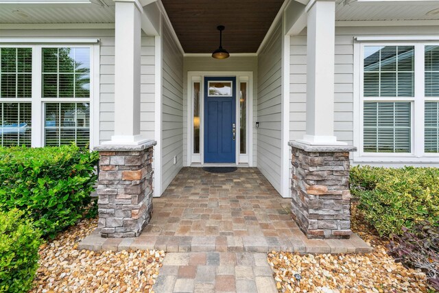 213 Pescado Dr, Saint Augustine, FL 32095 - doorway to property featuring a porch