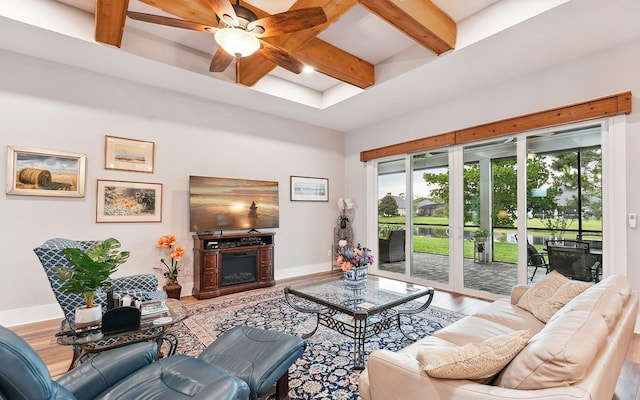 213 Pescado Dr, Saint Augustine, FL 32095 - living room featuring wood finished floors, beamed ceiling, a ceiling fan, baseboards, and a fireplace