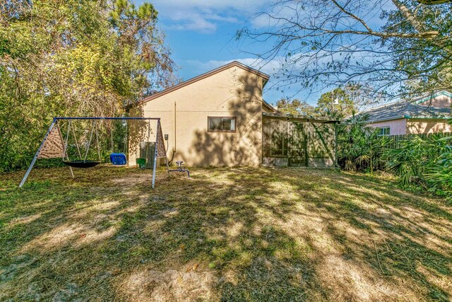 29 Hybiscus Ave, Saint Augustine, FL 32084 - view of grassy yard with a playground