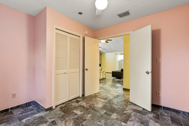 29 Hybiscus Ave, Saint Augustine, FL 32084 - corridor featuring dark stone finish flooring and baseboards