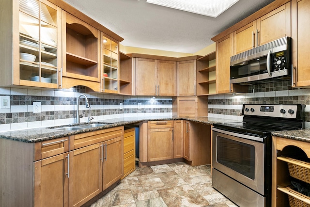 29 Hybiscus Ave, Saint Augustine, FL 32084 - kitchen featuring open shelves, stainless steel appliances, a sink, dark stone counters, and tasteful backsplash